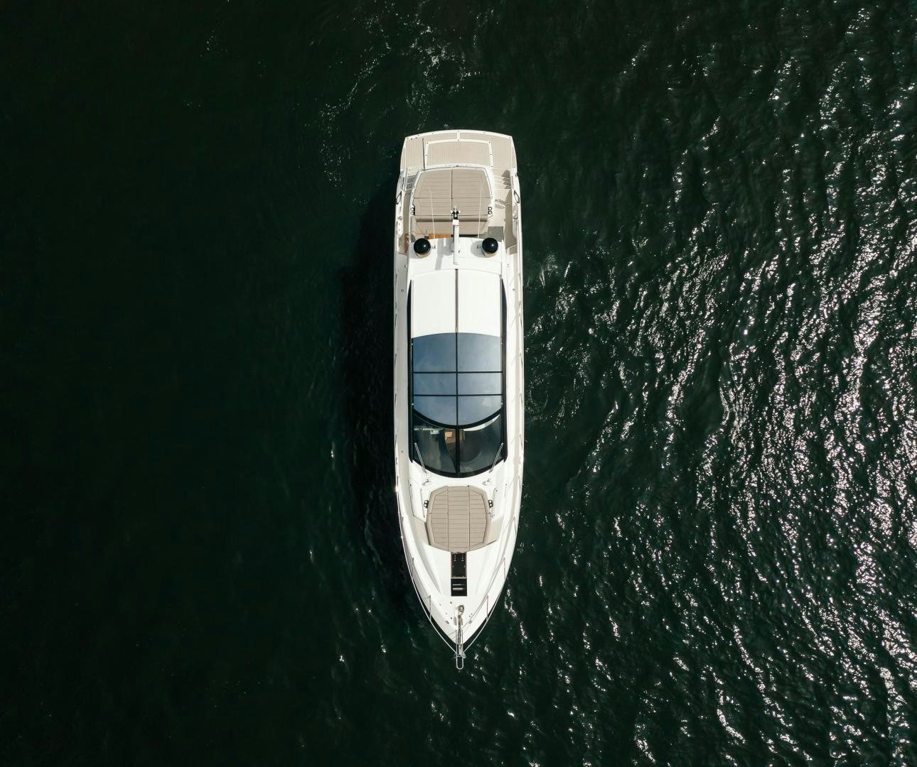 a white car in the rain aboard GRAVITAS Yacht for Sale