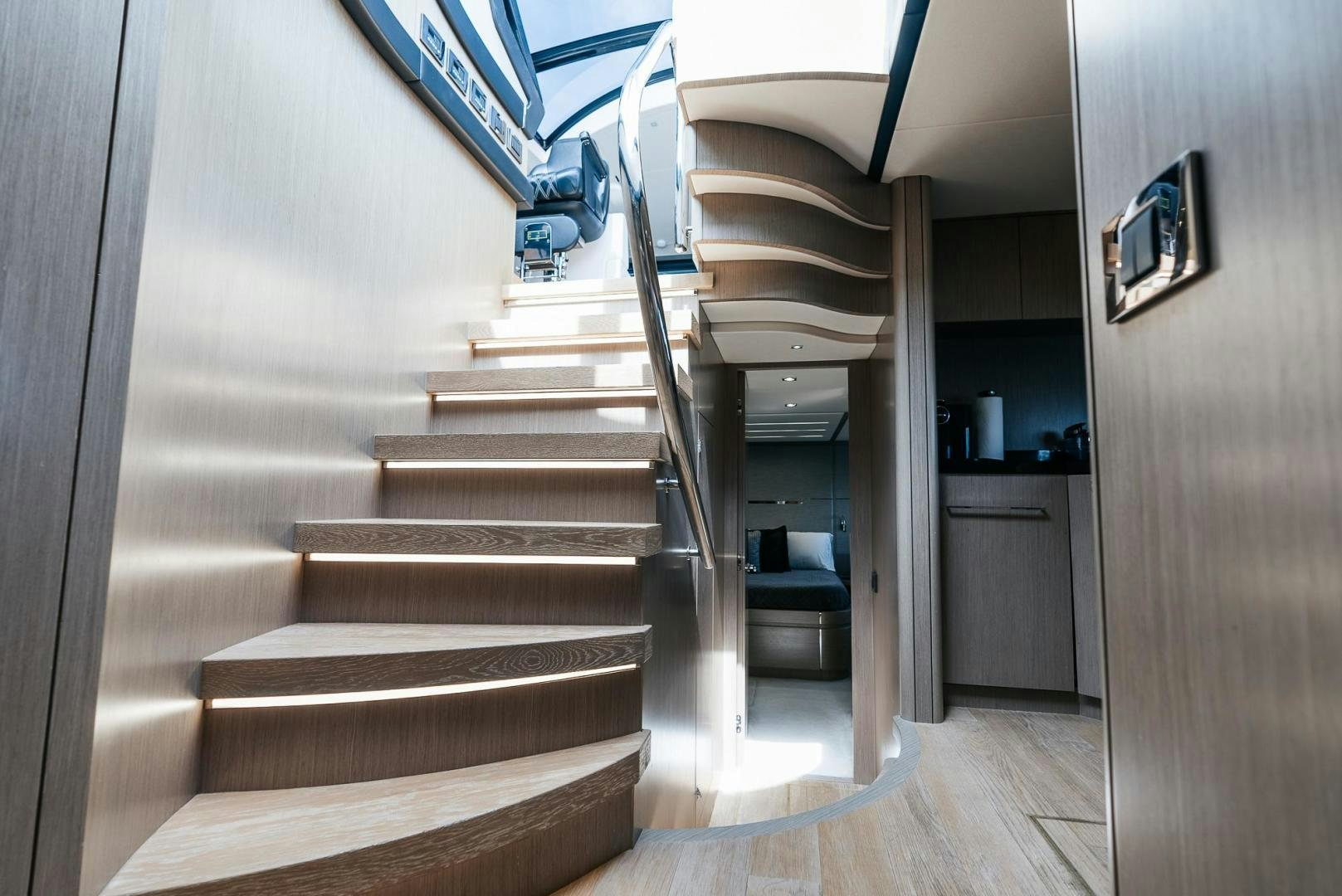 a staircase with a glass door aboard GRAVITAS Yacht for Sale