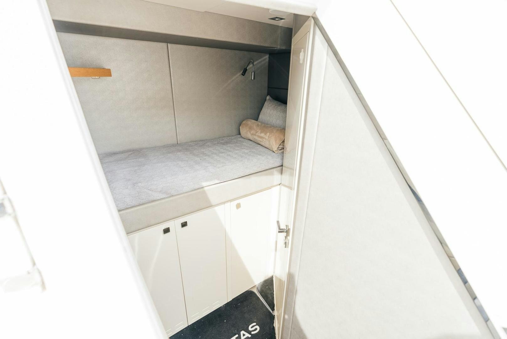 a white cabinet with drawers aboard GRAVITAS Yacht for Sale