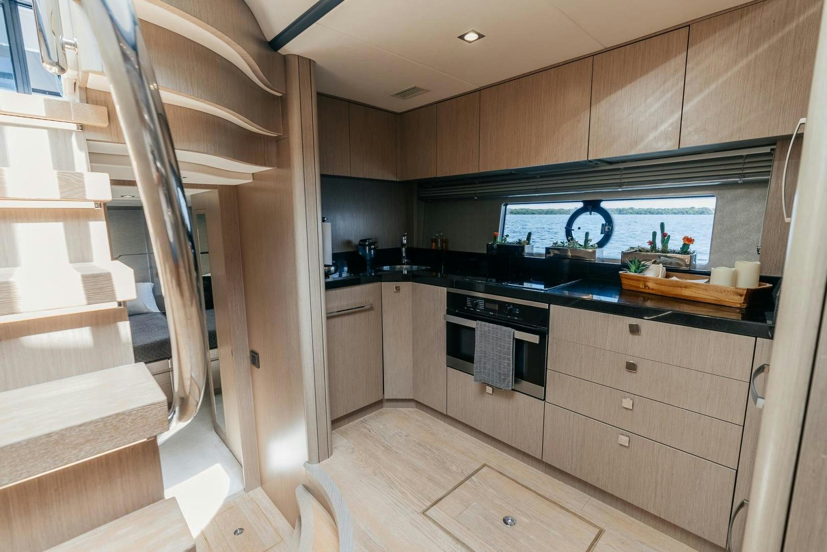 a kitchen with wooden cabinets aboard GRAVITAS Yacht for Sale