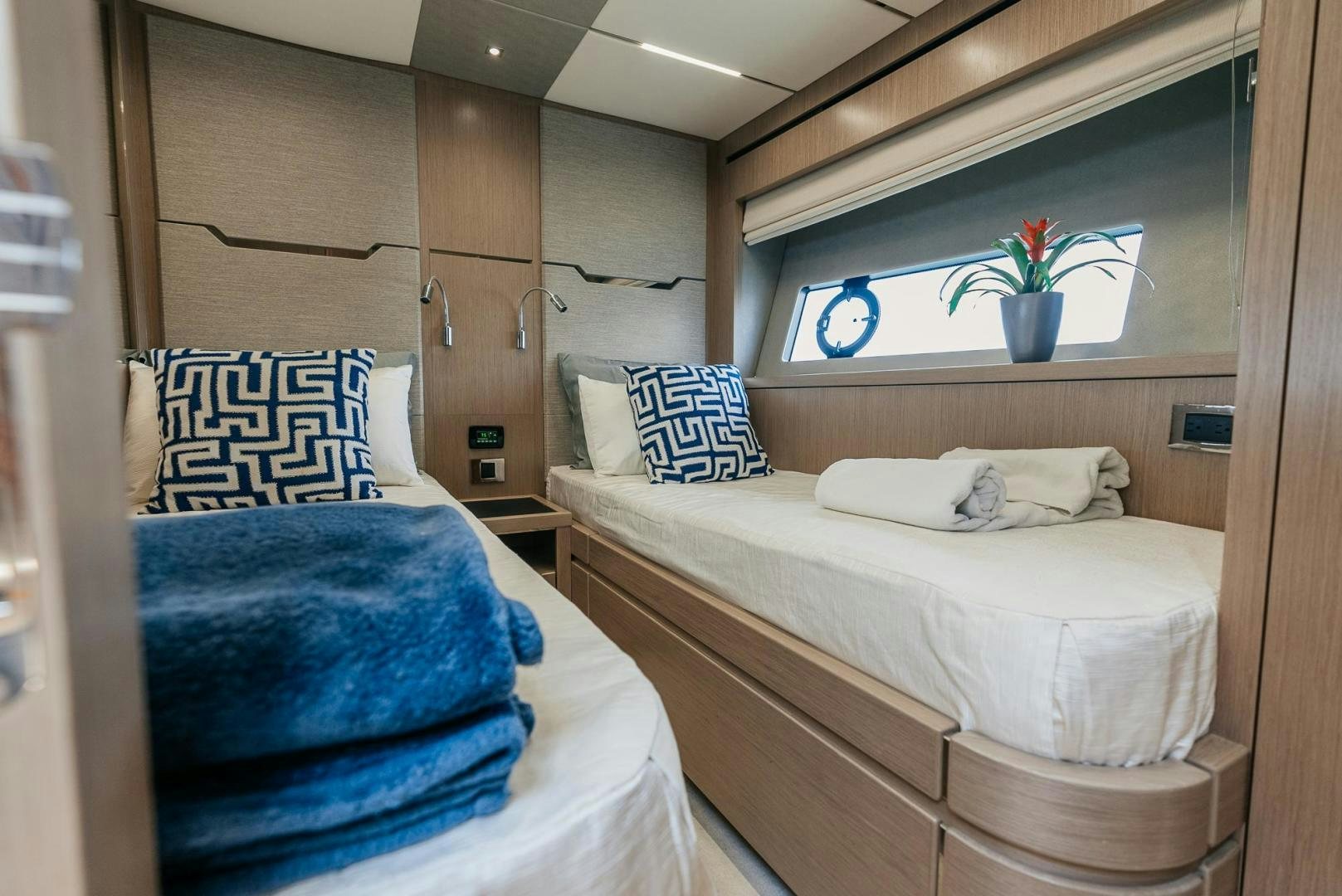 a couple of beds in a room aboard GRAVITAS Yacht for Sale