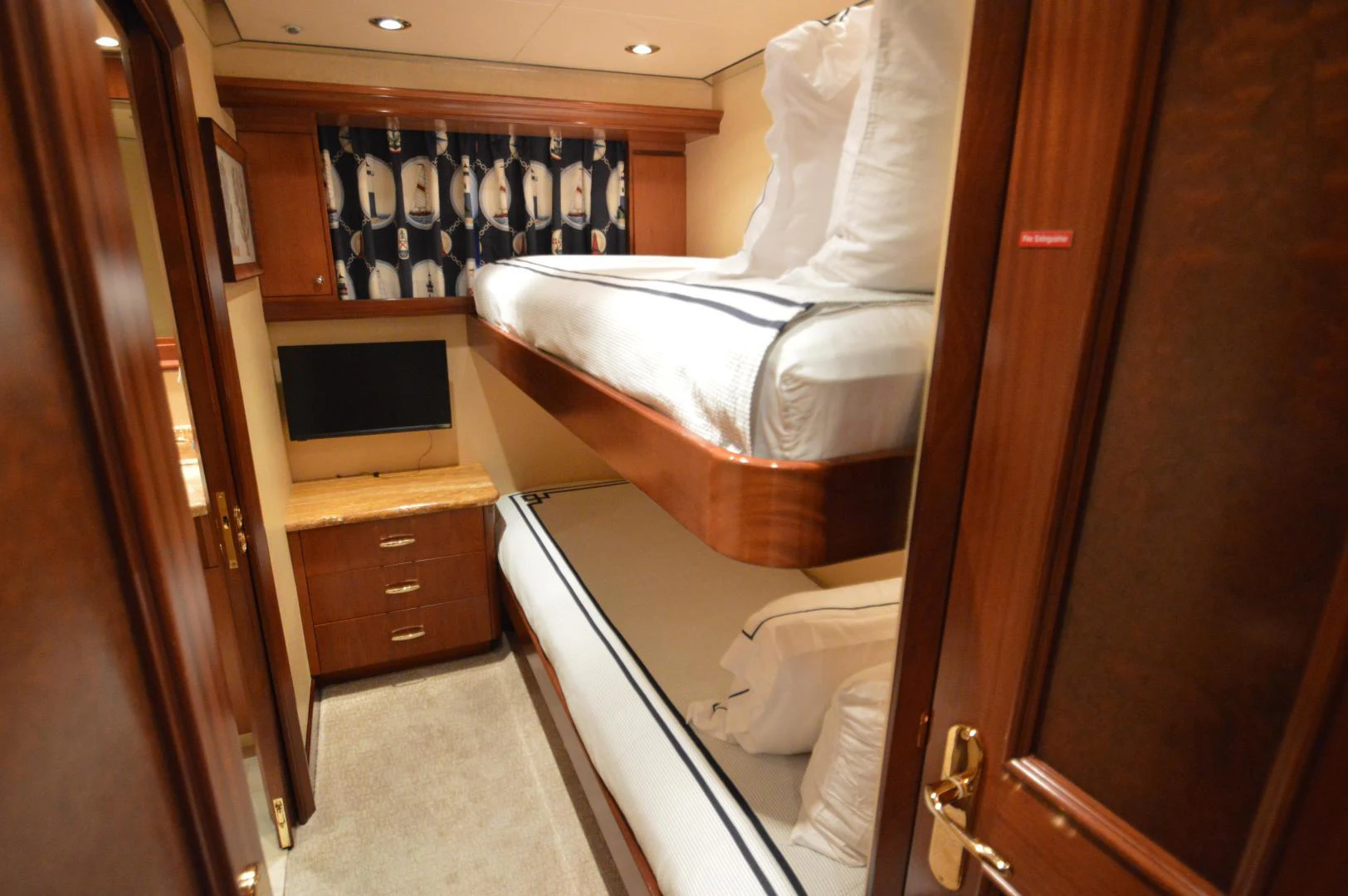 a room with a bed and a television aboard JOAN'S ARK Yacht for Sale