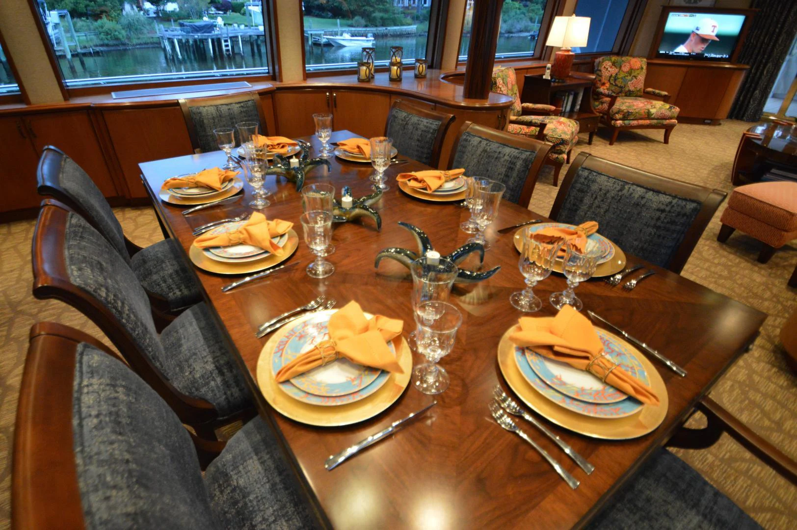 a table with plates and glasses on it aboard JOAN'S ARK Yacht for Sale