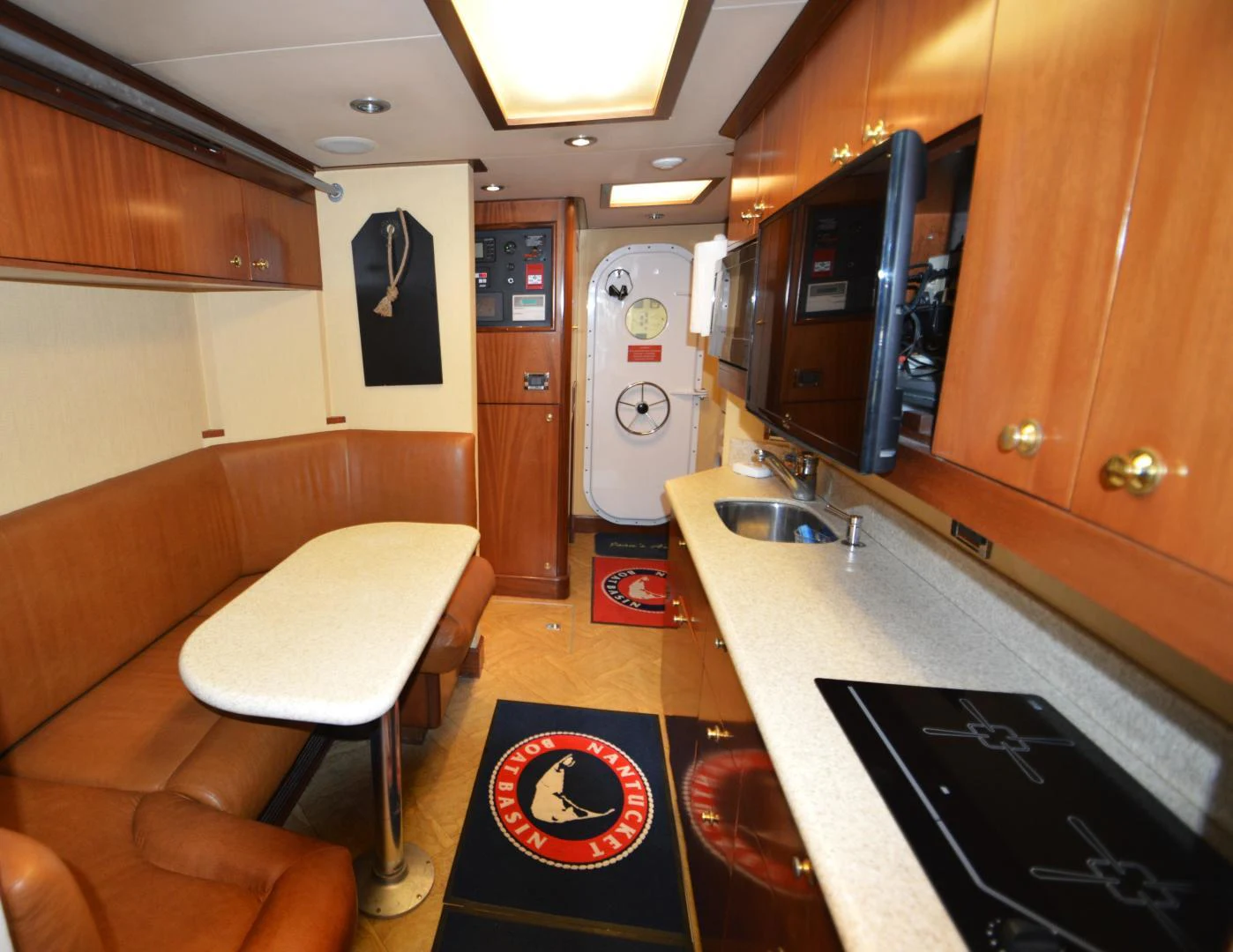 a kitchen with a bar and a bar aboard JOAN'S ARK Yacht for Sale