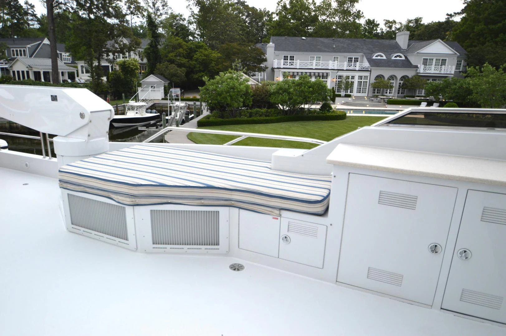 a white house with a pool aboard JOAN'S ARK Yacht for Sale
