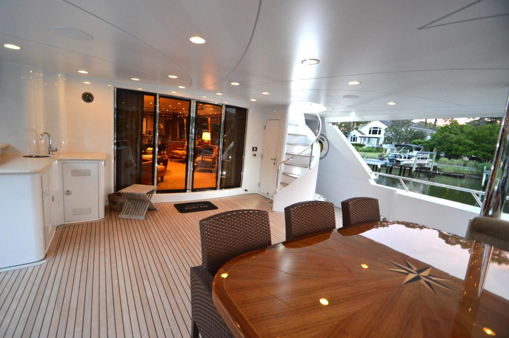 a large open space with a table and chairs and a large window aboard JOAN'S ARK Yacht for Sale