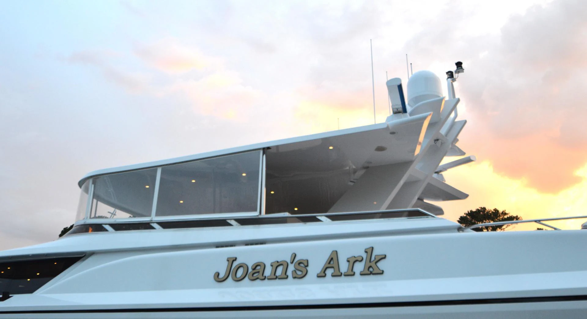 a white yacht on the water aboard JOAN'S ARK Yacht for Sale