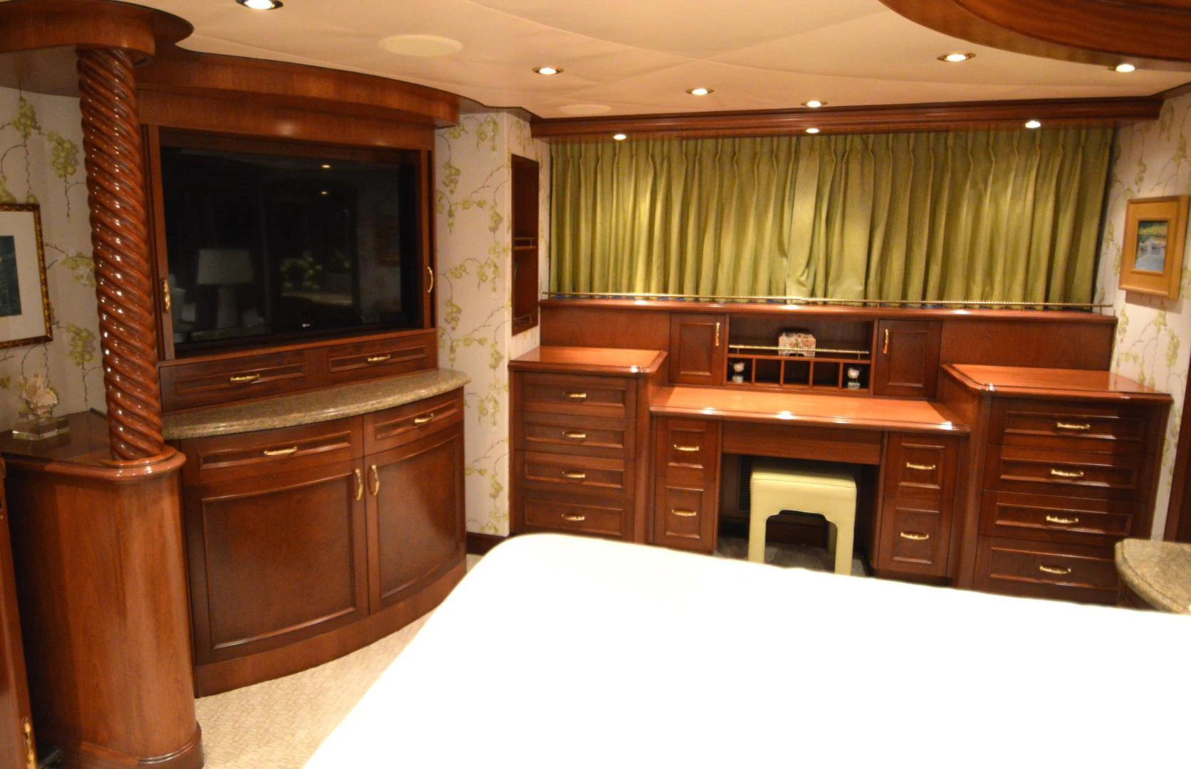 a room with a green curtain and a fireplace aboard JOAN'S ARK Yacht for Sale