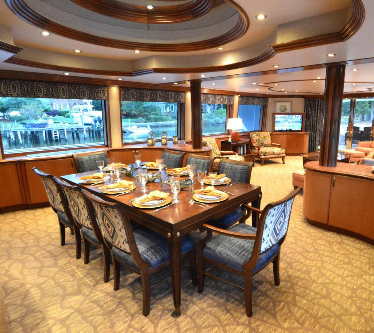 a large dining table in a large room aboard JOAN'S ARK Yacht for Sale