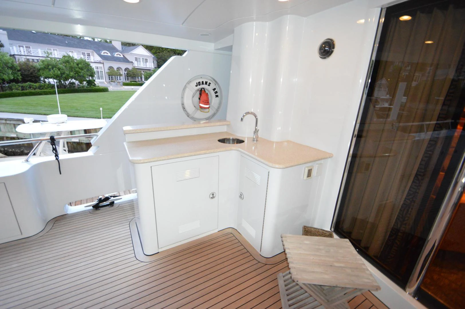 a white kitchen with a washing machine aboard JOAN'S ARK Yacht for Sale