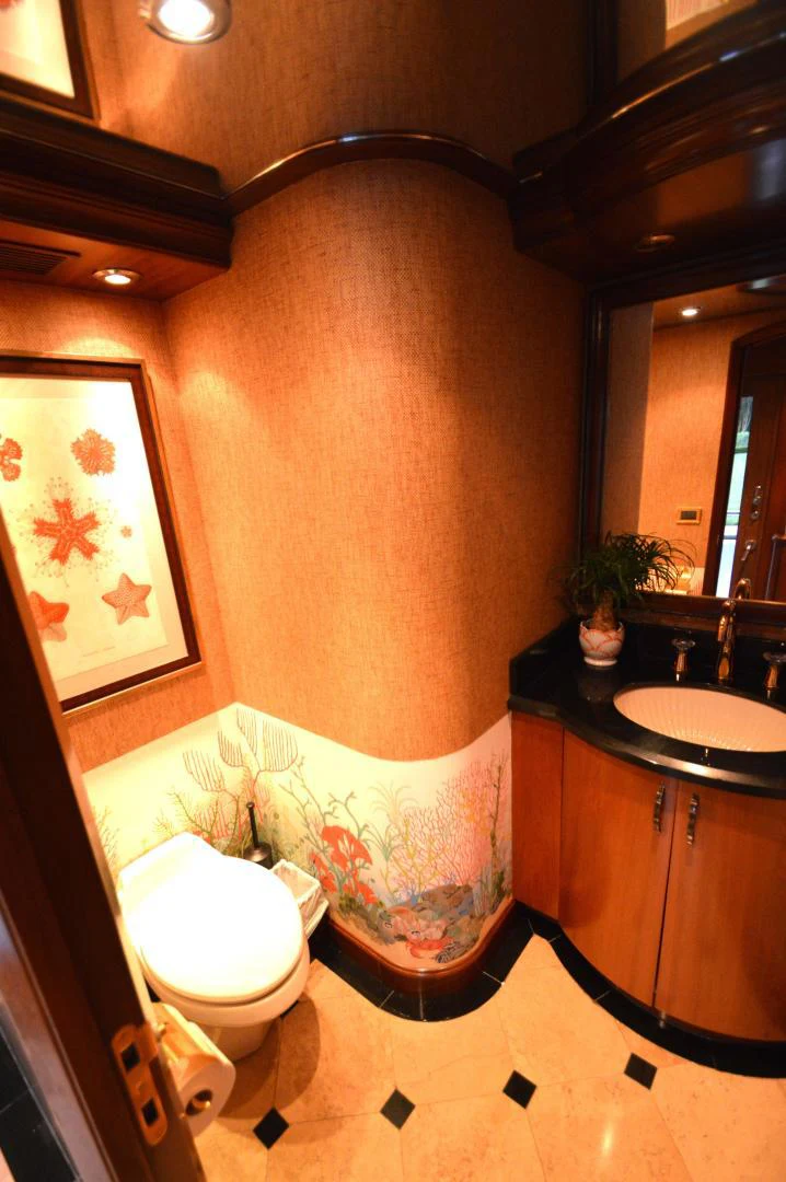 a bathroom with a bathtub and toilet aboard JOAN'S ARK Yacht for Sale