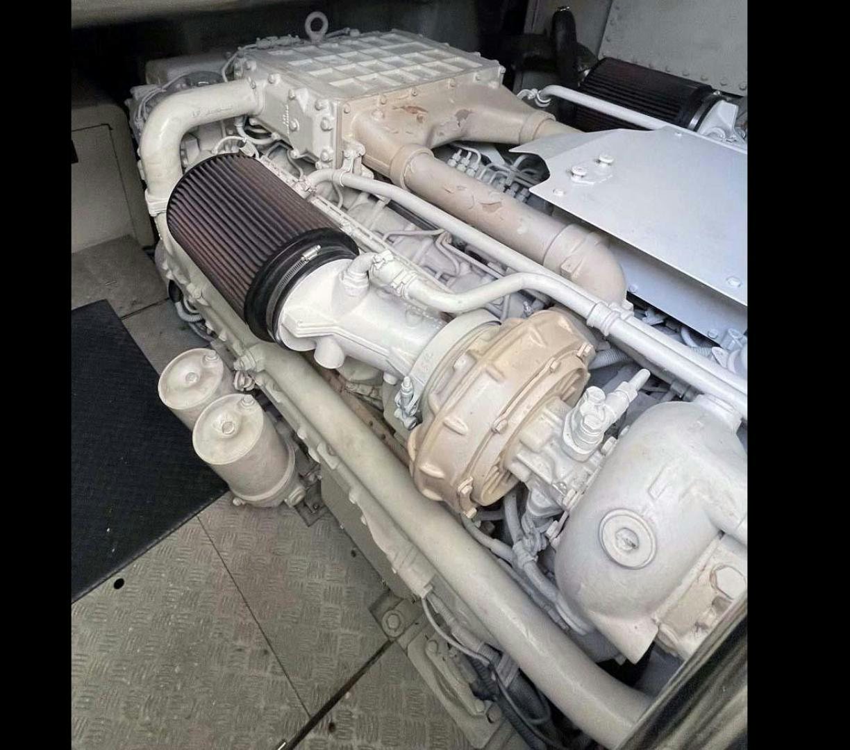 a car engine with a hood open aboard ARTISTIC Yacht for Sale