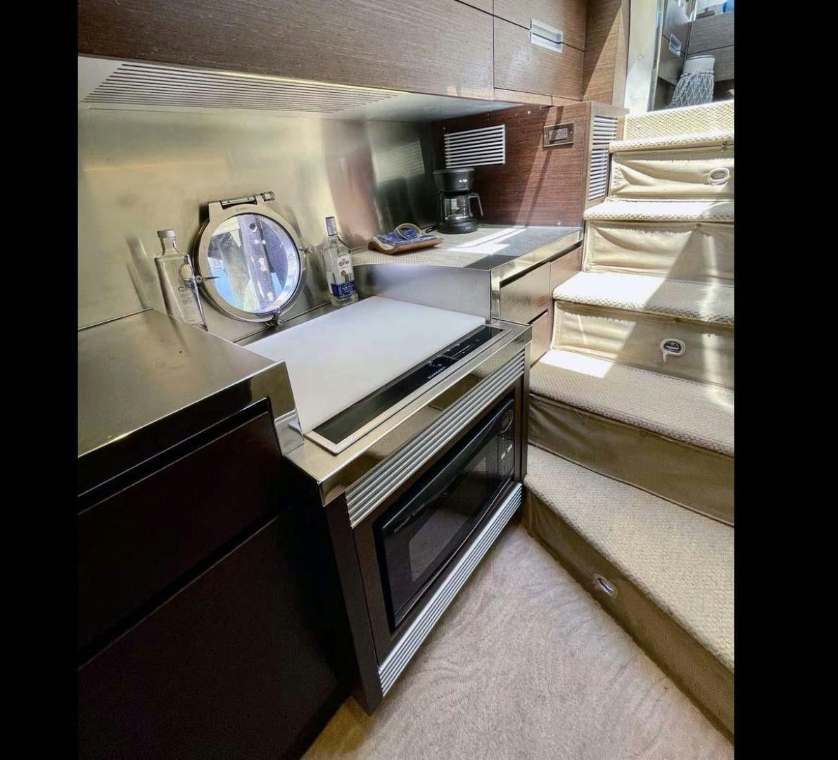 a kitchen with a sink and a stove aboard ARTISTIC Yacht for Sale