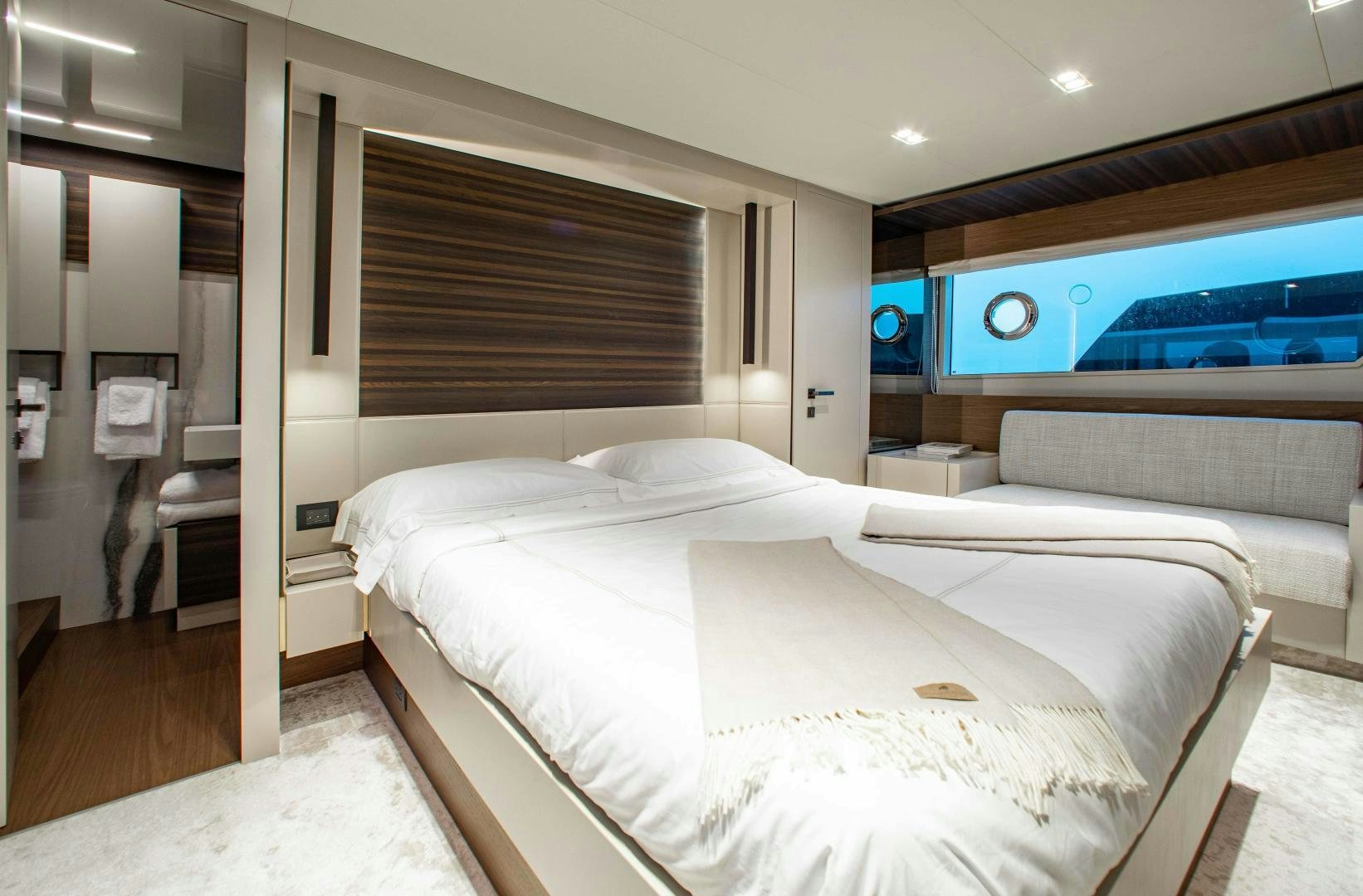a room with a bed and a television aboard Ferretti 670 Yacht for Sale
