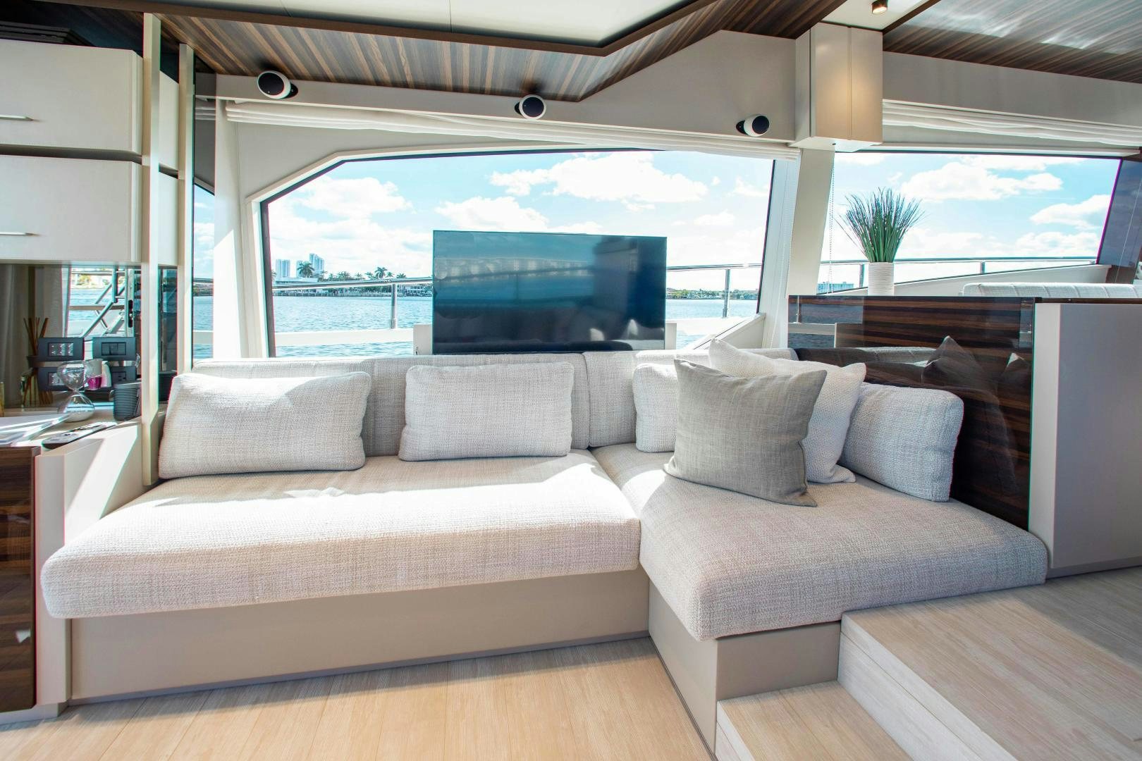 a couch in a room aboard Ferretti 670 Yacht for Sale