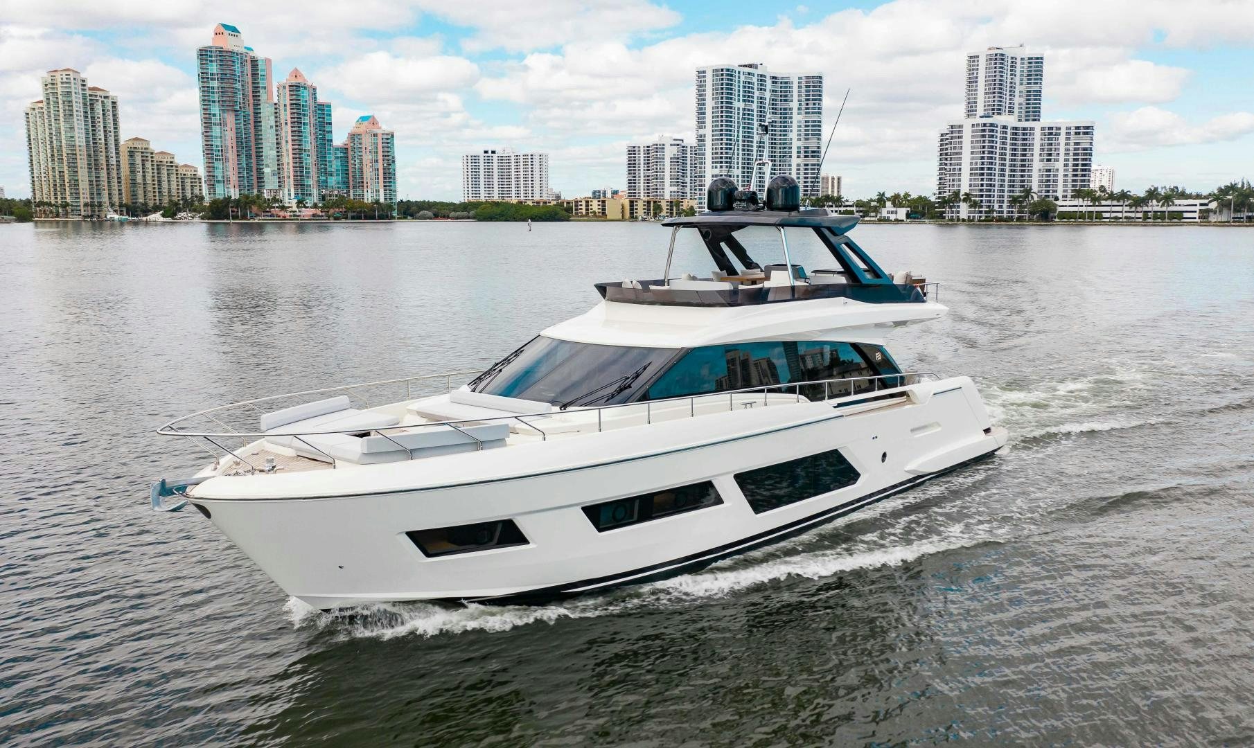 a boat on the water aboard Ferretti 670 Yacht for Sale