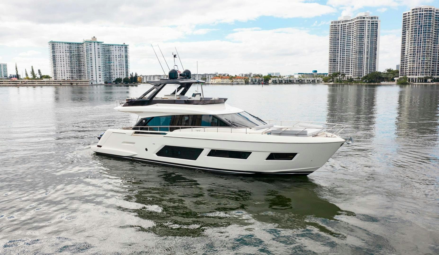 a white boat on the water aboard Ferretti 670 Yacht for Sale