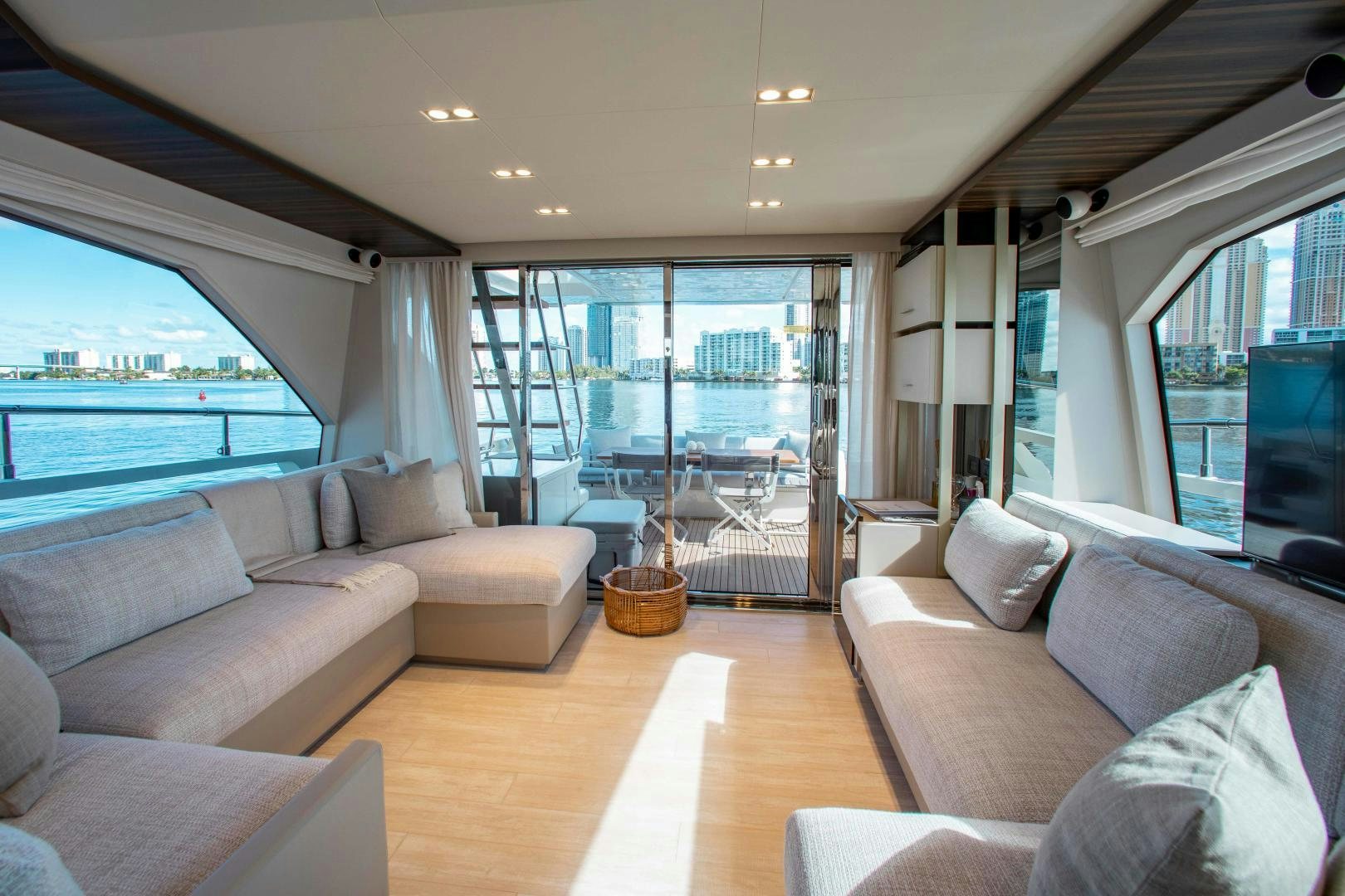 a living room with a large window aboard Ferretti 670 Yacht for Sale