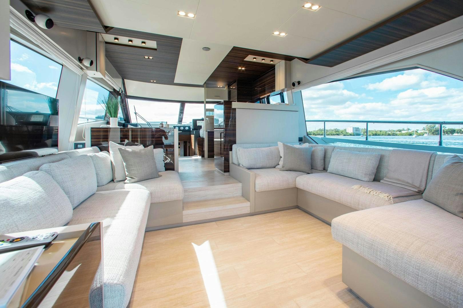 a living room with a large window aboard Ferretti 670 Yacht for Sale
