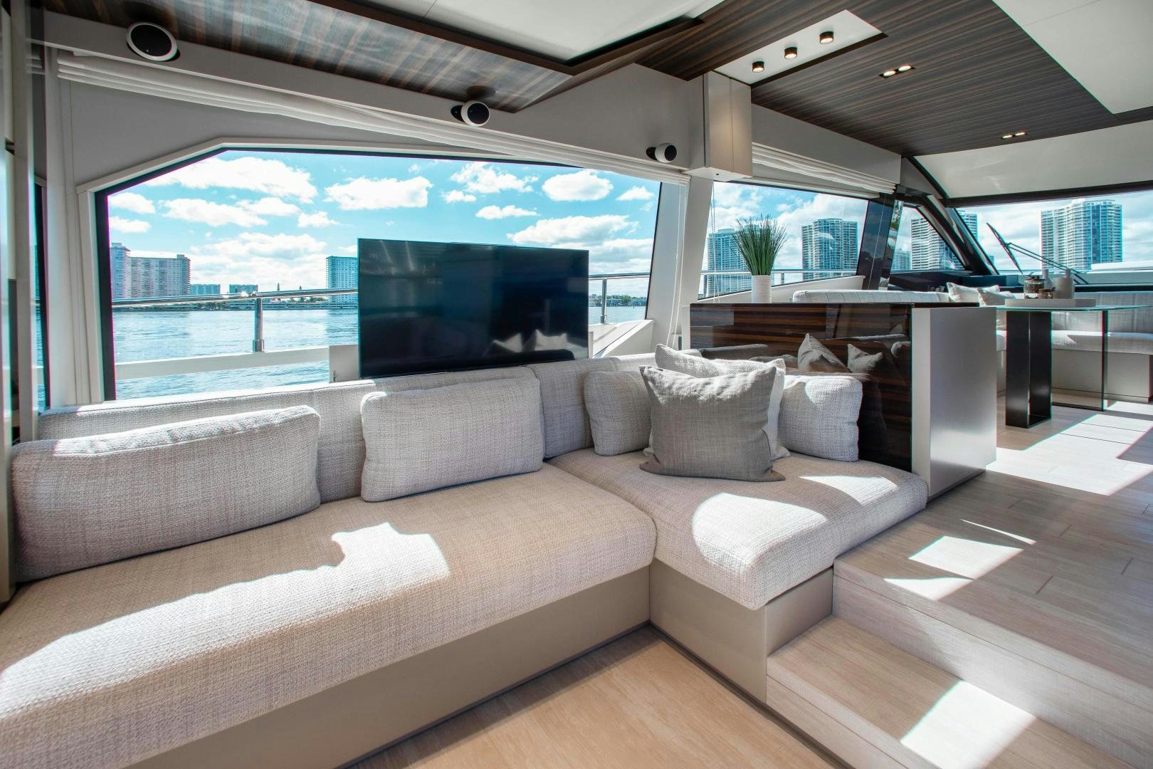 a couch in a room aboard Ferretti 670 Yacht for Sale