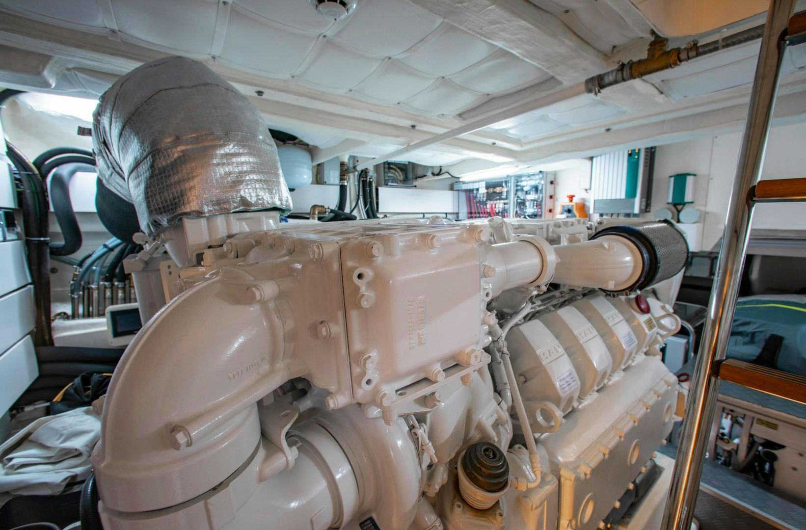 a large metal machine aboard Ferretti 670 Yacht for Sale