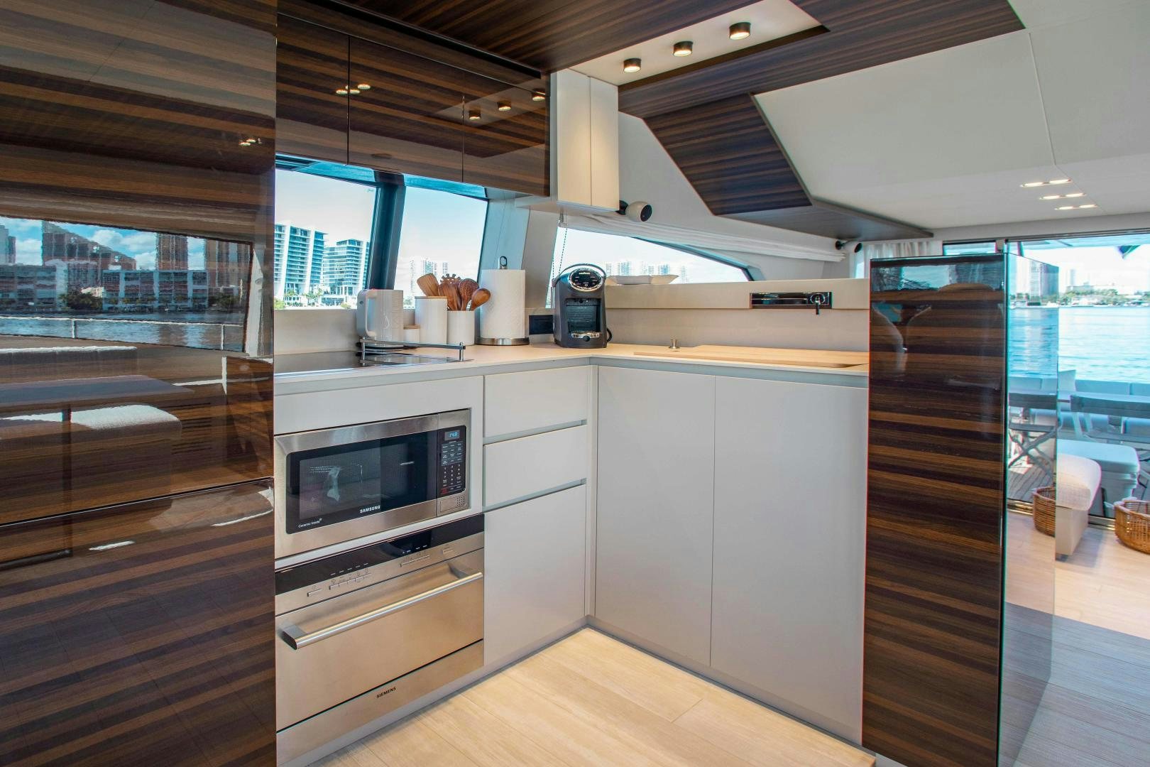 a kitchen with a glass door aboard Ferretti 670 Yacht for Sale