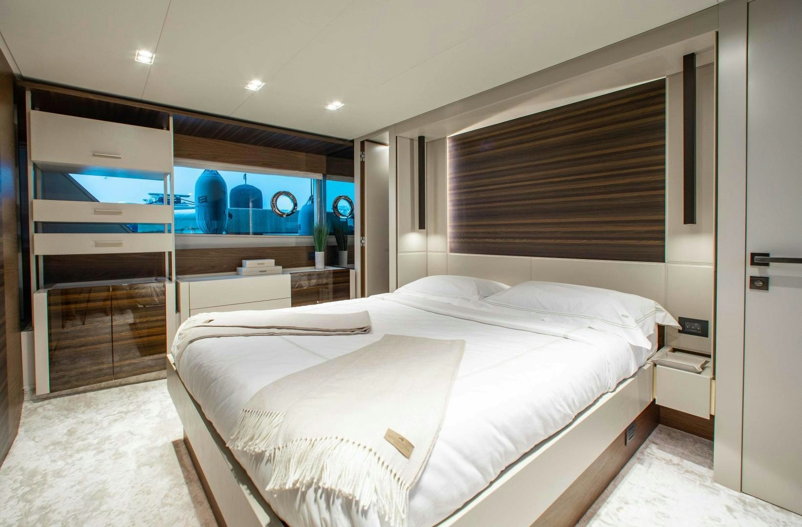 a room with a bed and a mirror aboard Ferretti 670 Yacht for Sale