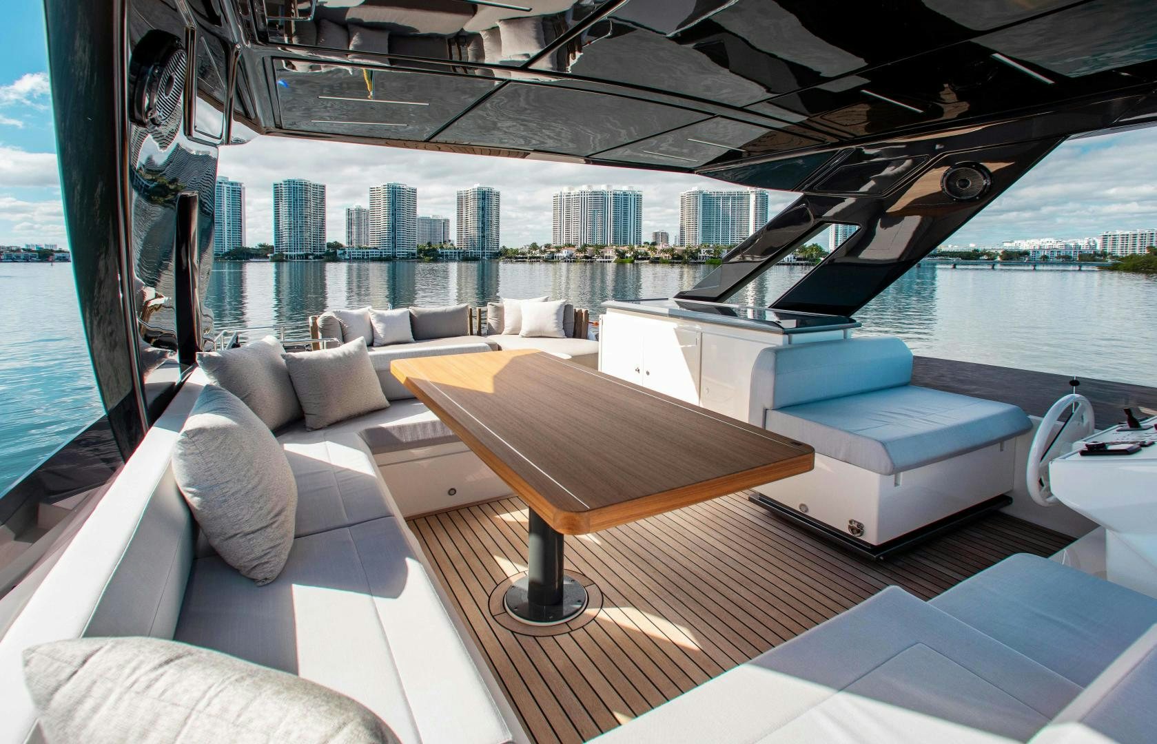 a room with a view of a city aboard Ferretti 670 Yacht for Sale