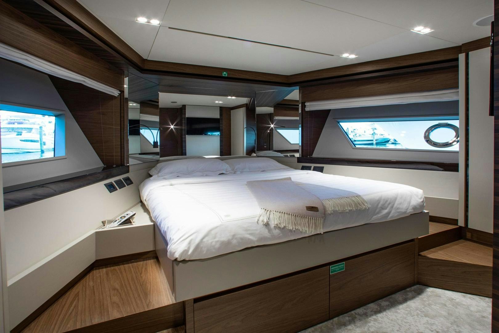 a bed in a room aboard Ferretti 670 Yacht for Sale