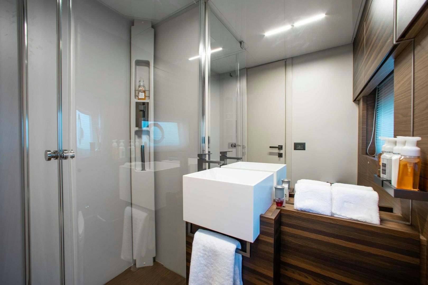 a bathroom with a sink and a mirror aboard Ferretti 670 Yacht for Sale