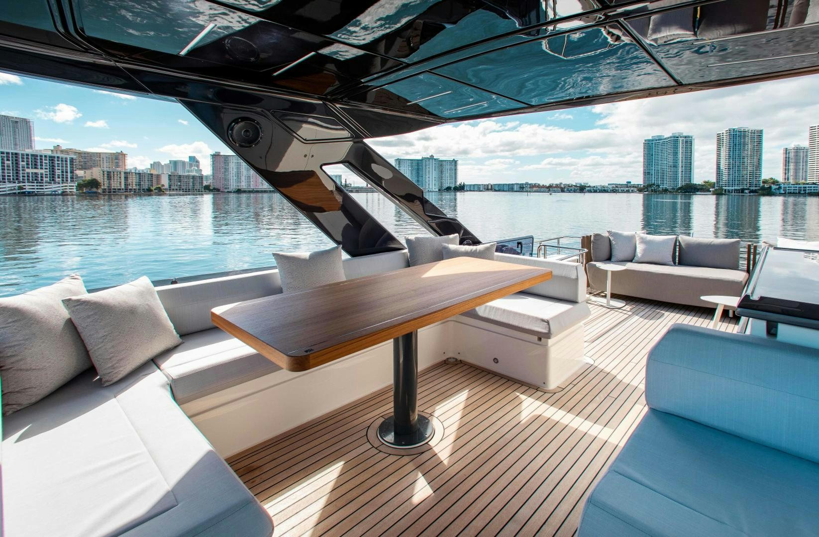 a room with a table and chairs aboard Ferretti 670 Yacht for Sale