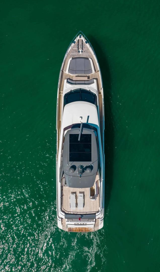 a white and black boat aboard CRAZY Yacht for Sale