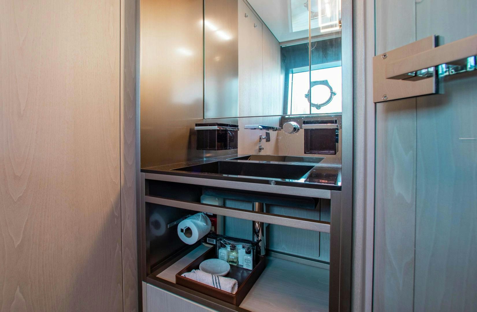 a kitchen with a sink and cabinets aboard CRAZY Yacht for Sale