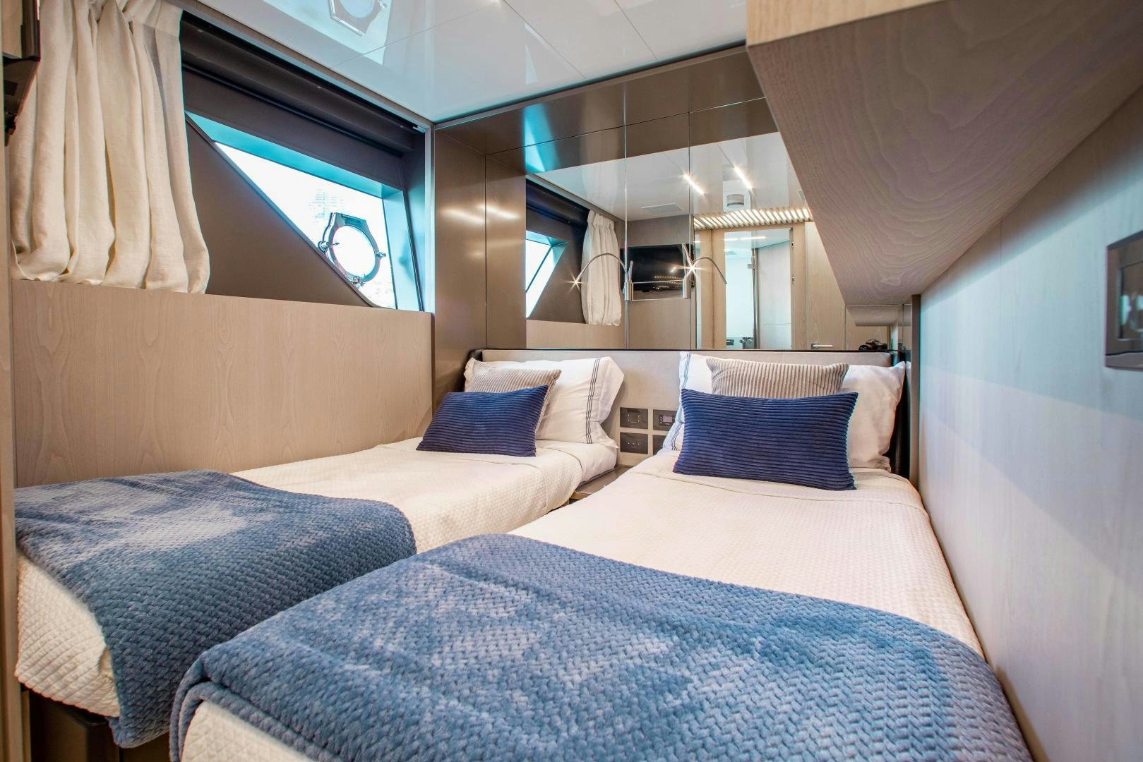 a room with two beds aboard CRAZY Yacht for Sale
