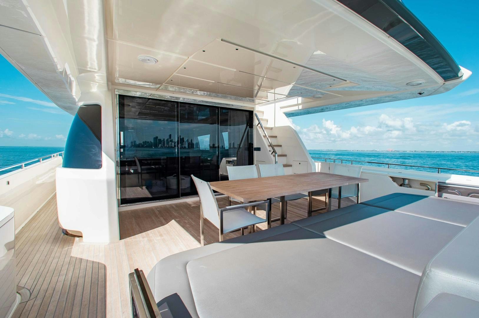 a room with a large window and a view of the ocean aboard CRAZY Yacht for Sale
