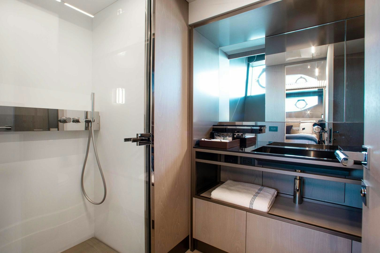 a bathroom with a sink and a mirror aboard CRAZY Yacht for Sale