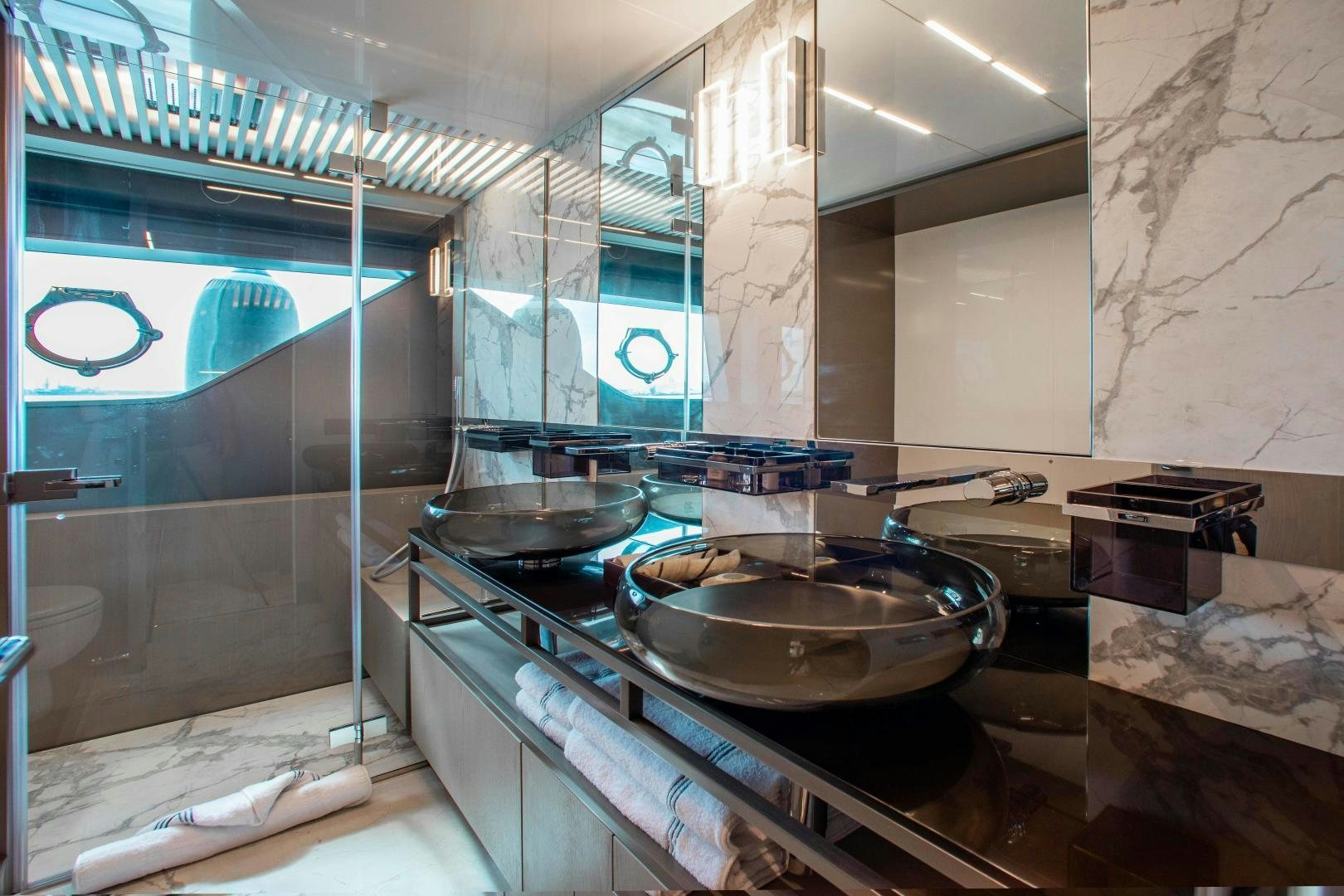 a kitchen with a sink and a large mirror aboard CRAZY Yacht for Sale