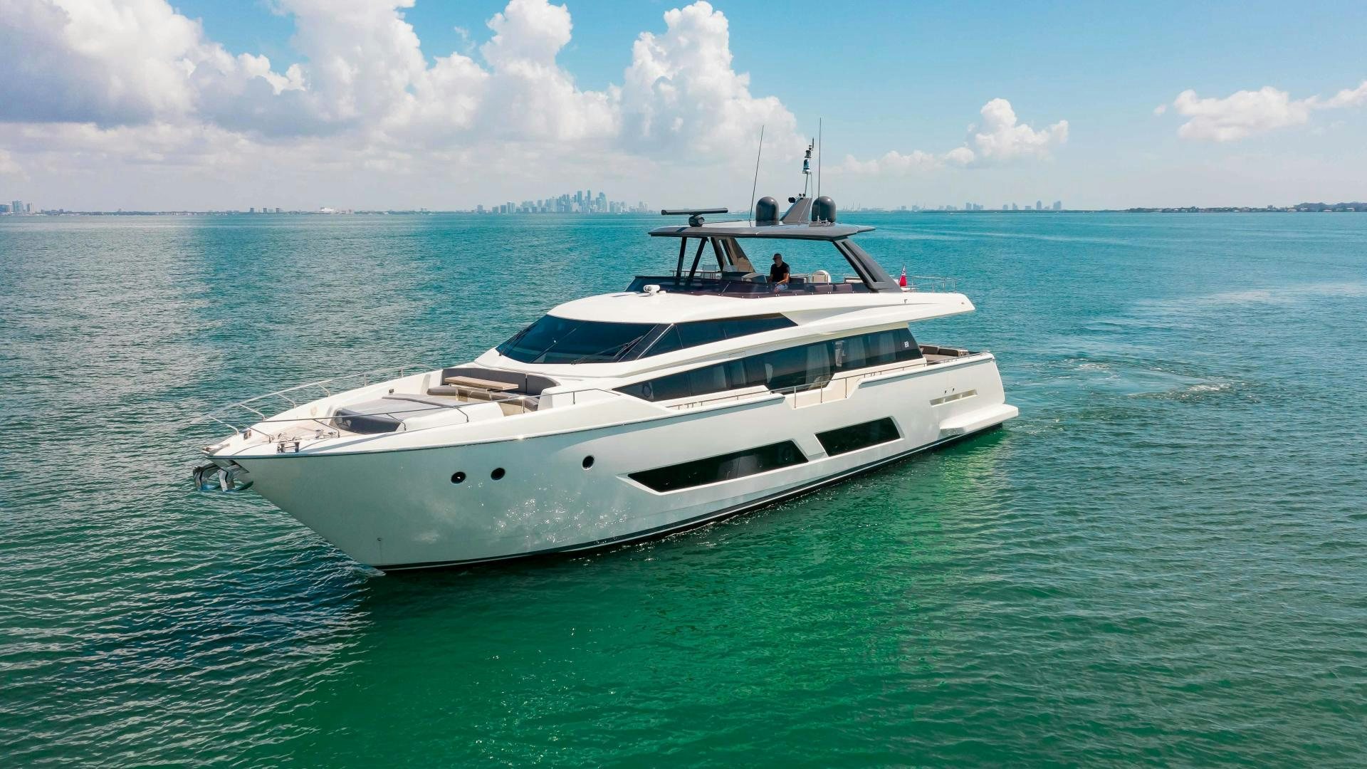 a white yacht in the ocean aboard CRAZY Yacht for Sale