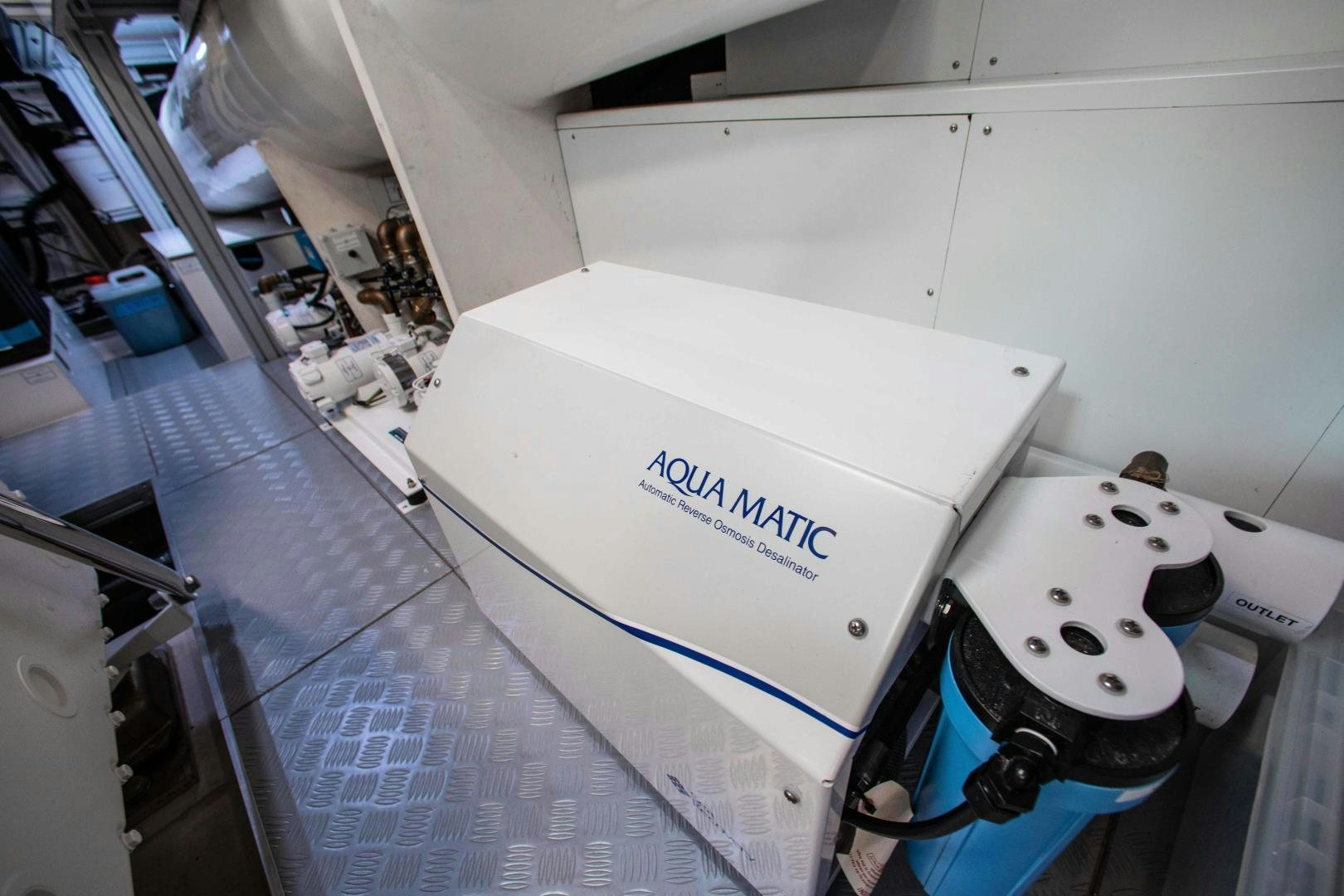 a white box with a black lid and a white box on a table aboard CRAZY Yacht for Sale