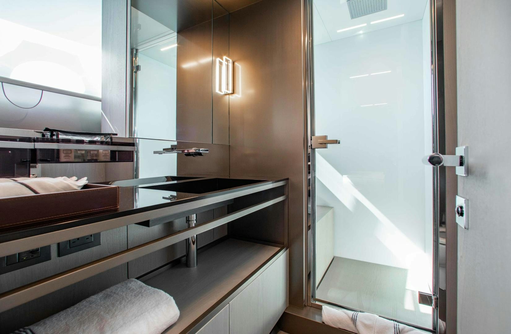 a bathroom with a sink and a mirror aboard CRAZY Yacht for Sale