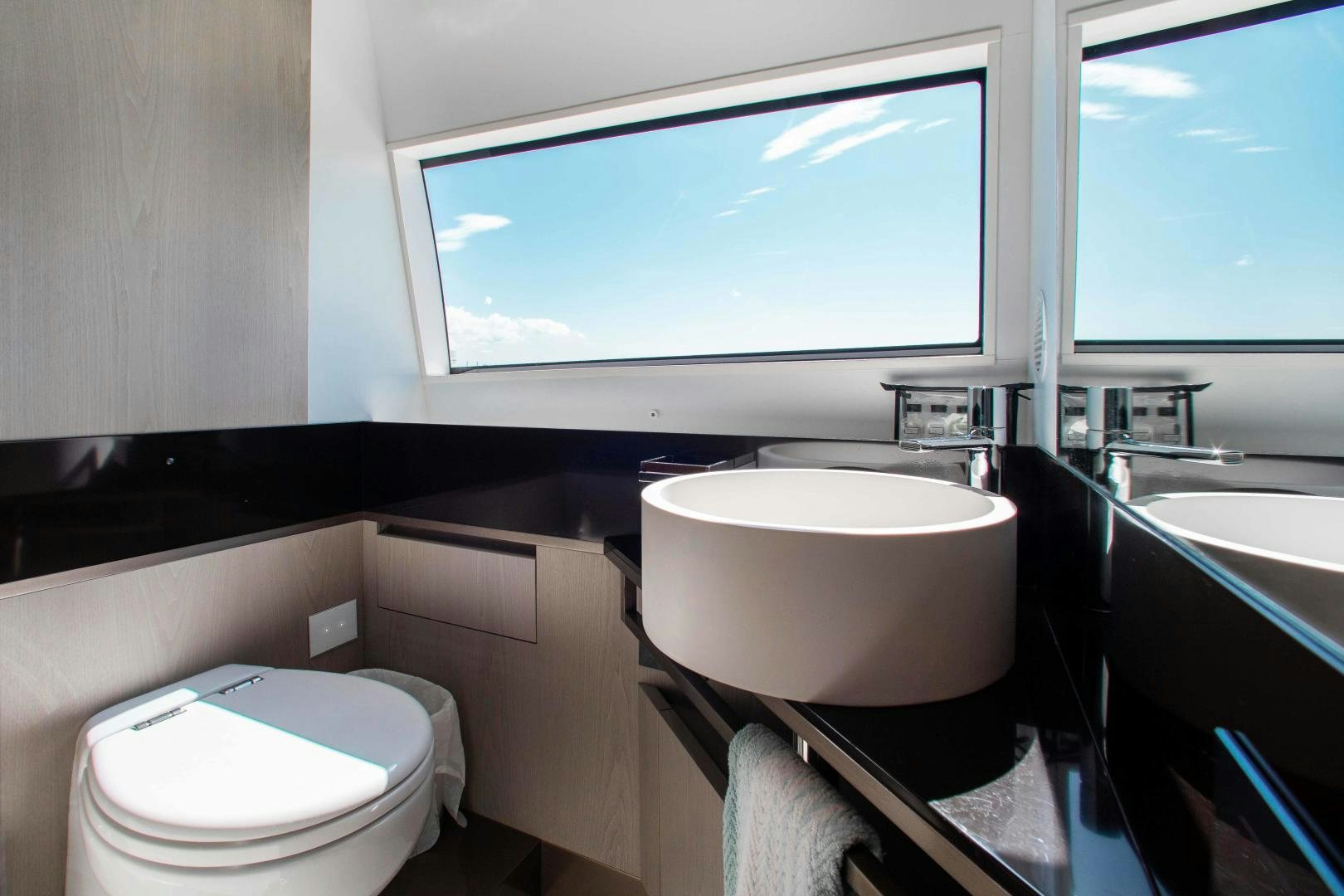 a bathroom with a large window aboard CRAZY Yacht for Sale