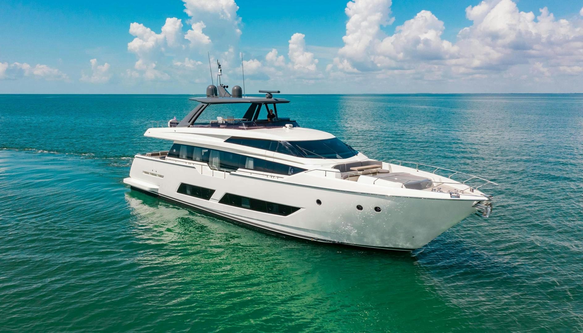 a white yacht in the water aboard CRAZY Yacht for Sale