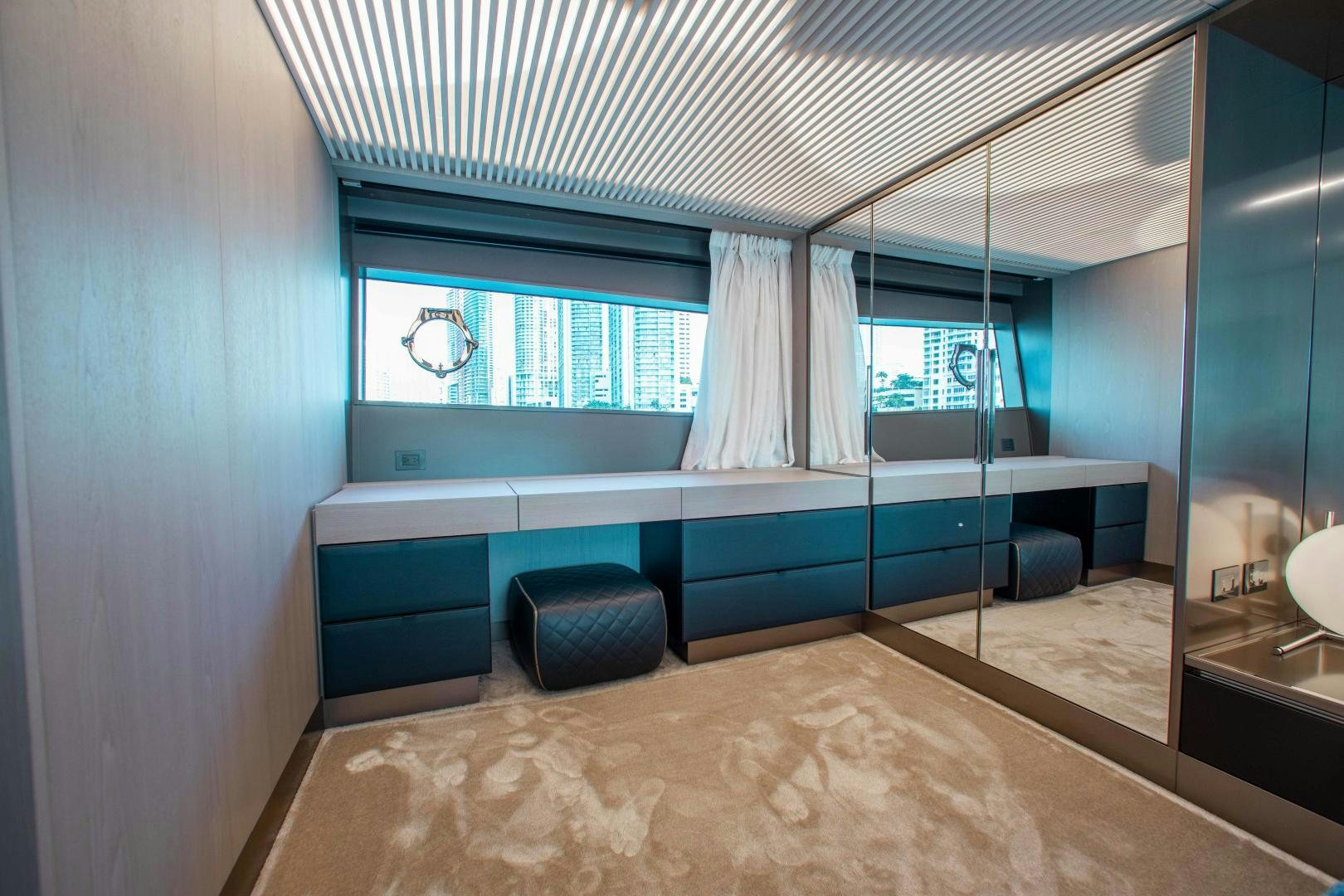 a room with a bed and a desk aboard CRAZY Yacht for Sale