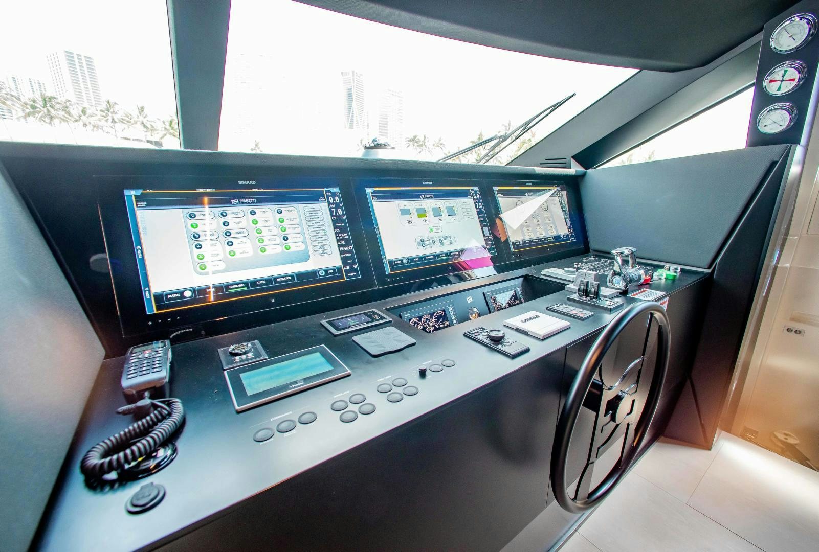 a control panel with many screens aboard CRAZY Yacht for Sale