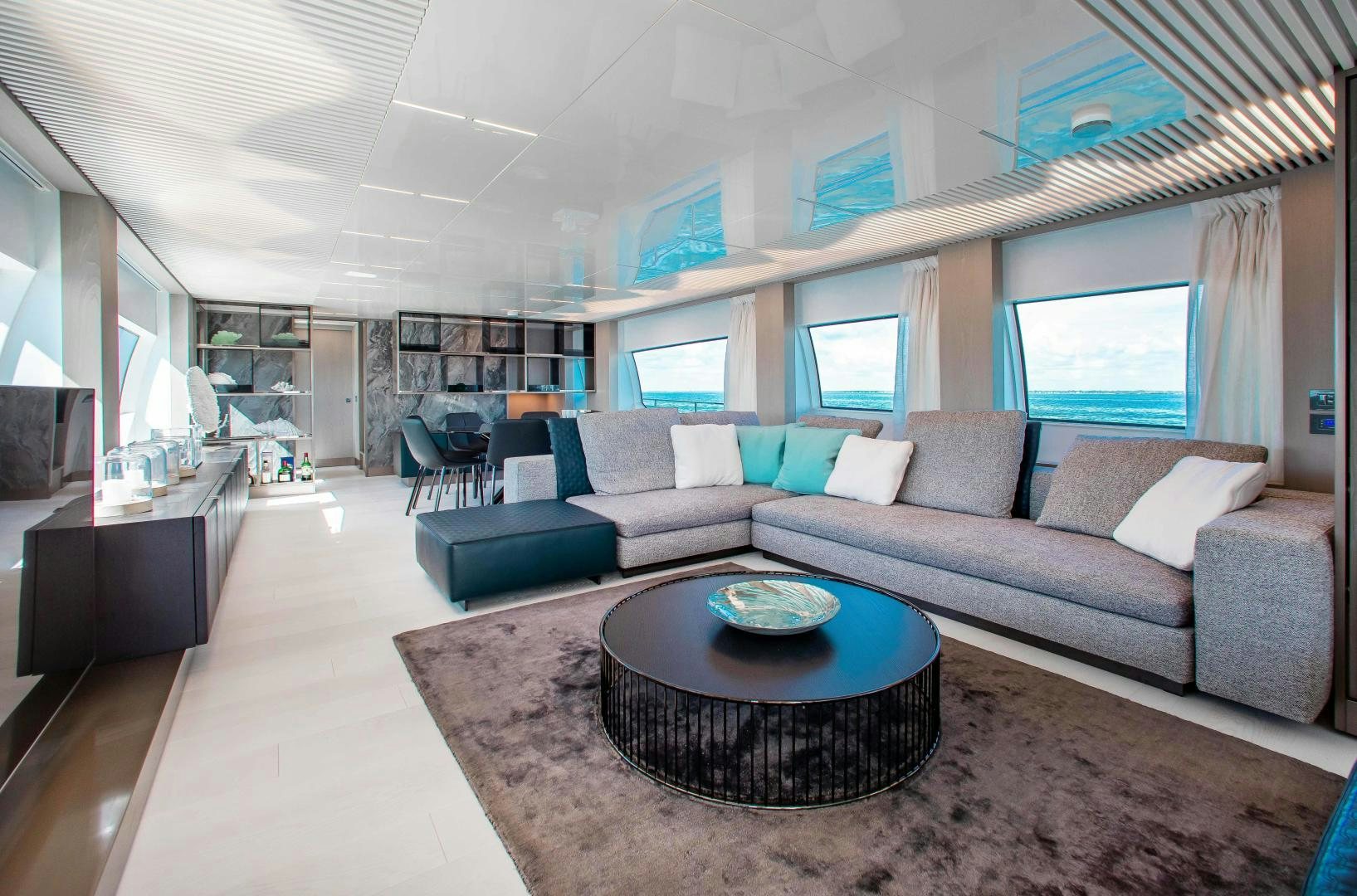 a living room with a couch and a coffee table aboard CRAZY Yacht for Sale