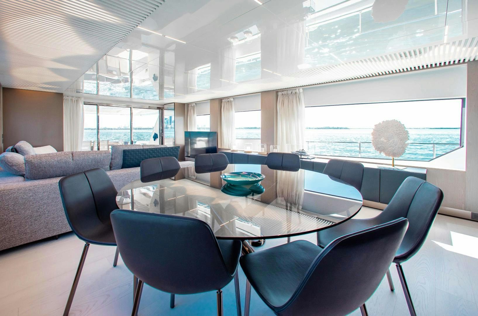 a room with a table and chairs aboard CRAZY Yacht for Sale