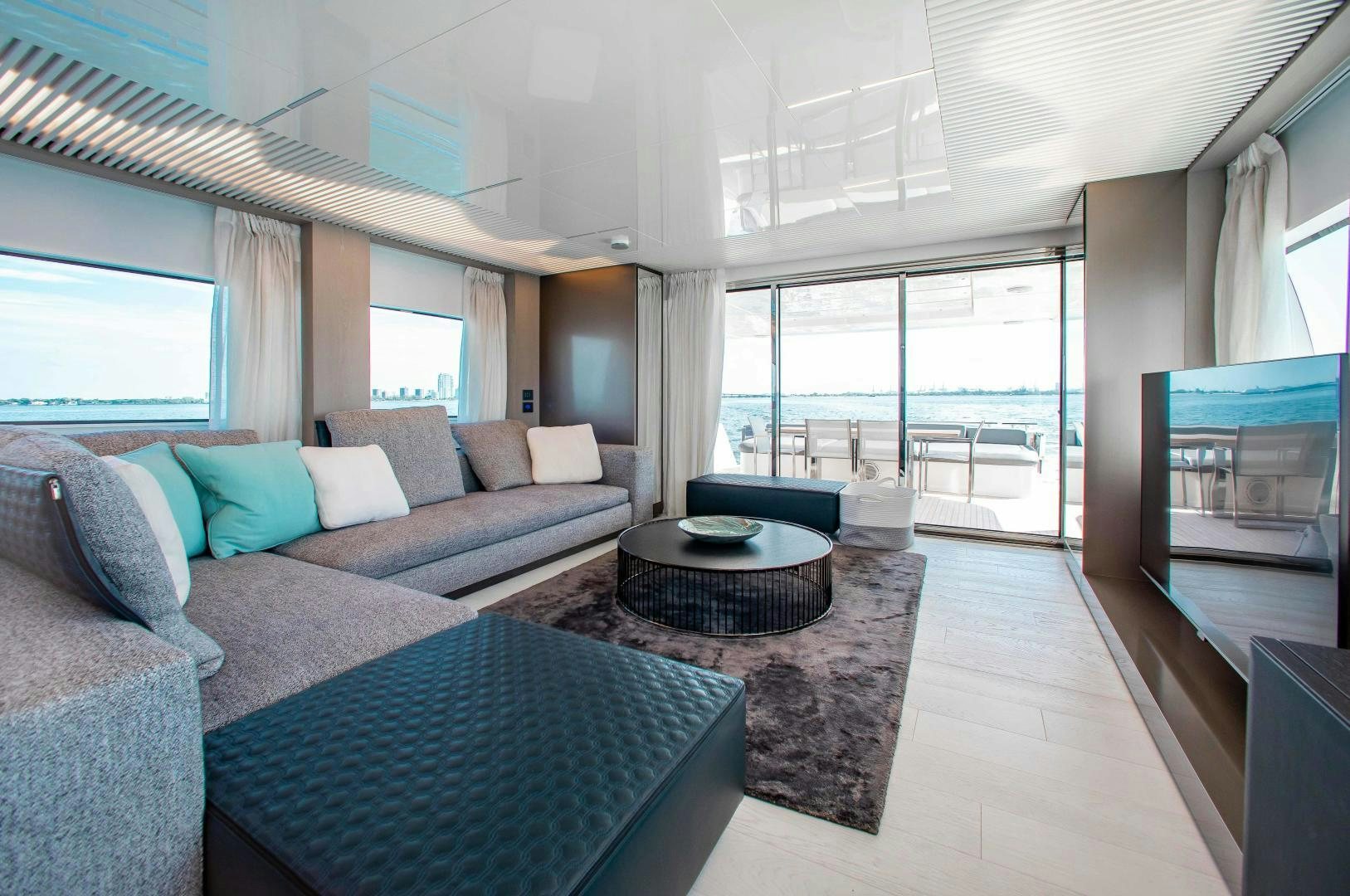 a living room with a large window aboard CRAZY Yacht for Sale