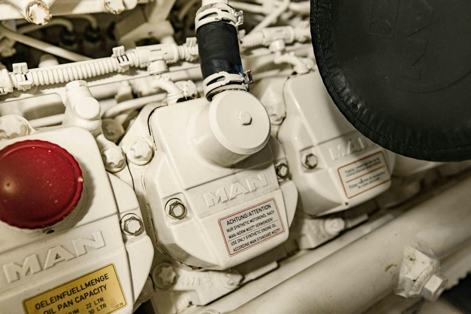 a white object with a black cap on it next to a white box with a red ball on aboard Azimut 70 Yacht for Sale