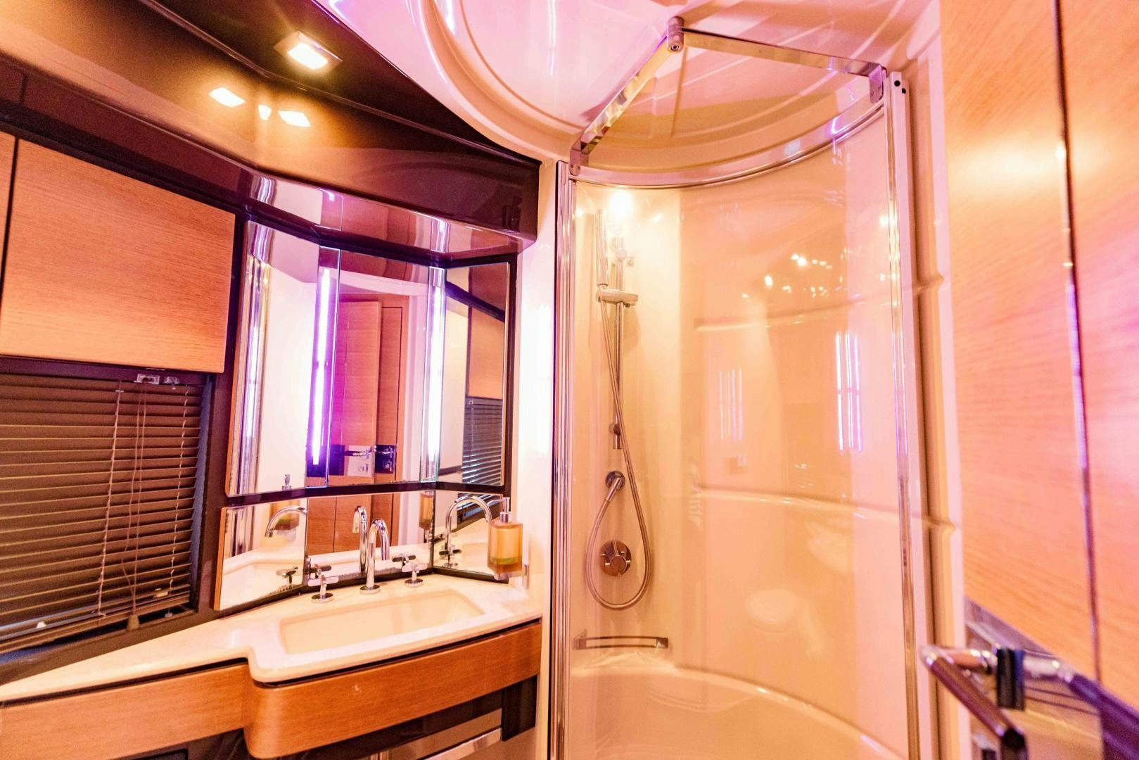 a bathroom with a shower and sink aboard Azimut 70 Yacht for Sale