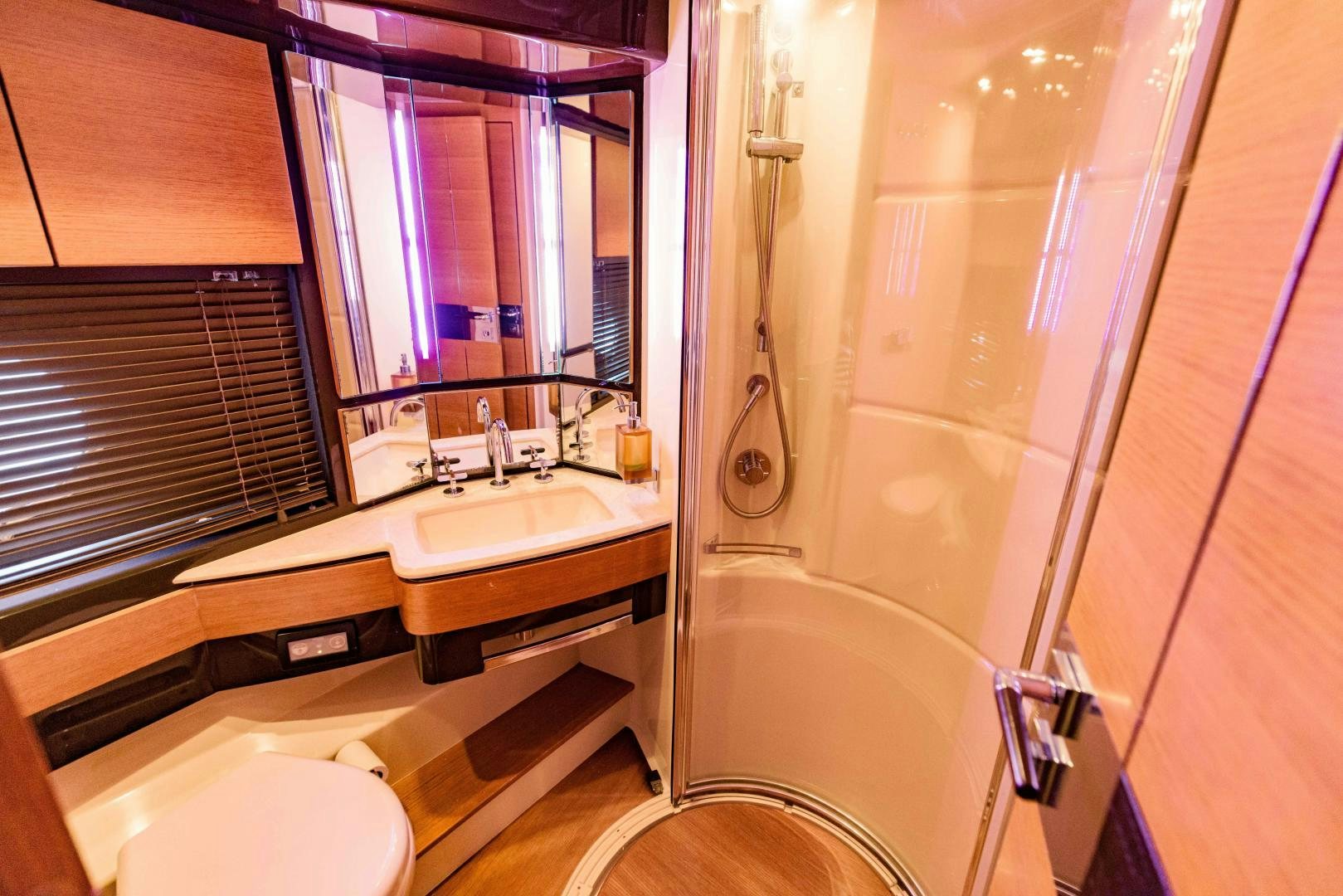 a bathroom with a tub sink and toilet aboard Azimut 70 Yacht for Sale
